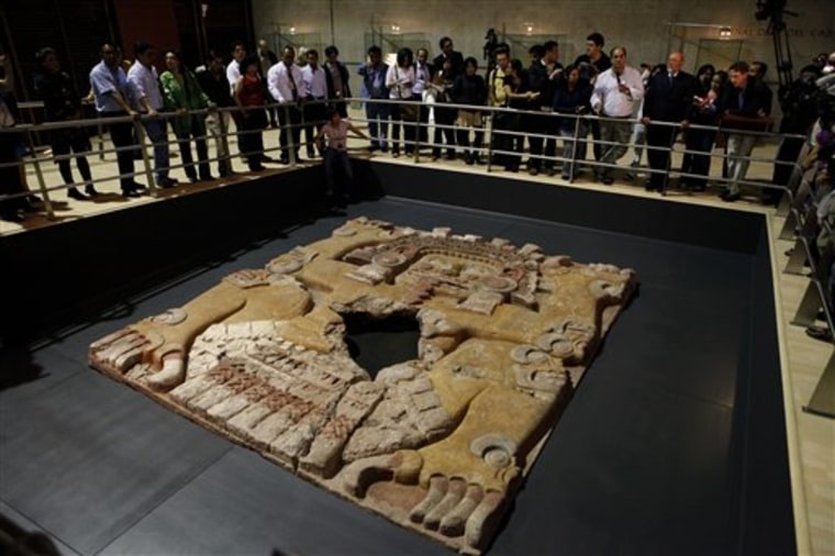 A massive stone sculpture of the Aztec goddess Tlaltecuhtli is displayed for the first time prior to the opening of the exposition "Moctezuma II, Times and Destiny of a Ruler" at Mexico City's Templo Mayor museum, June 16, 2010.